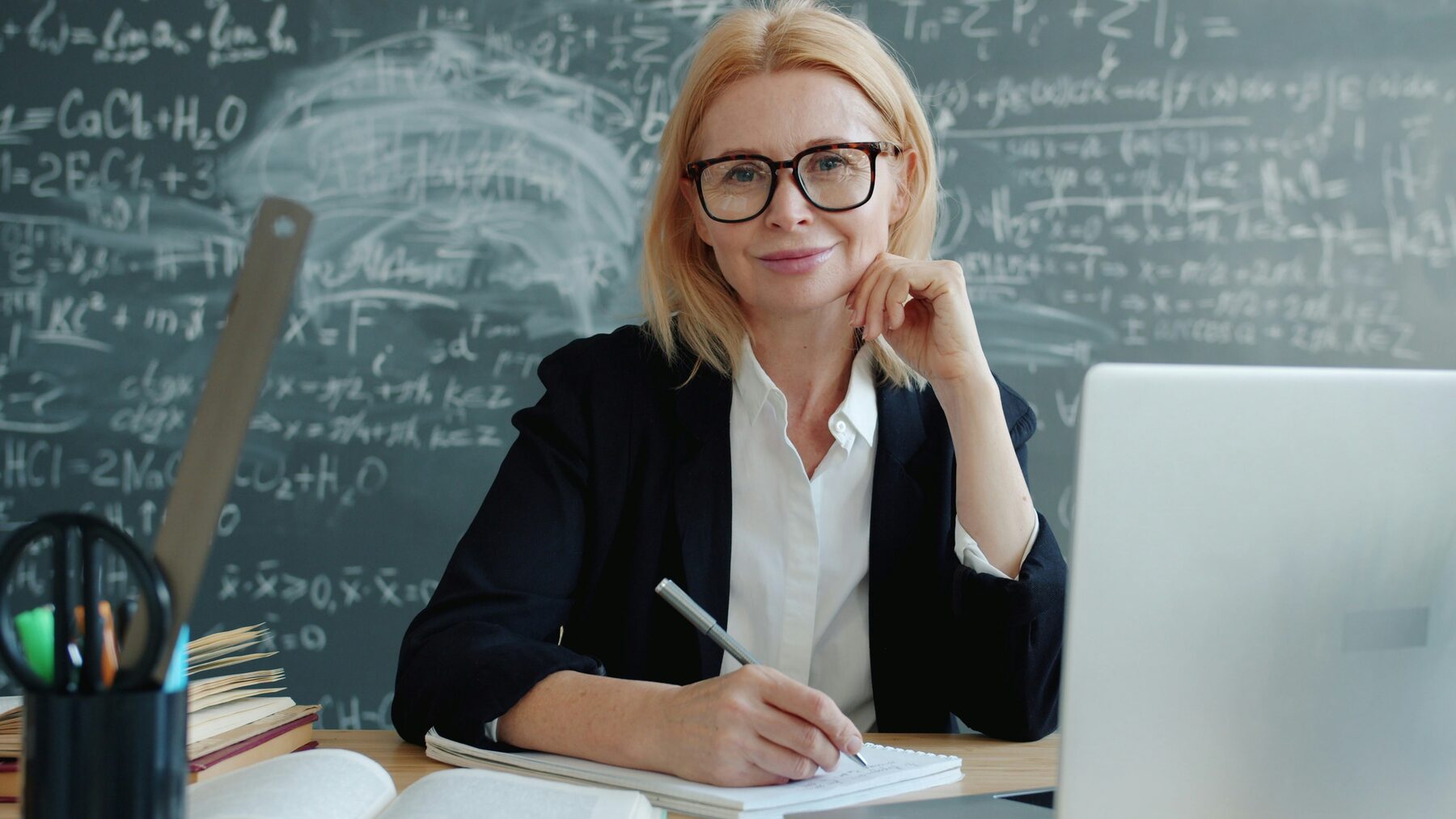 Female tutor at a desk