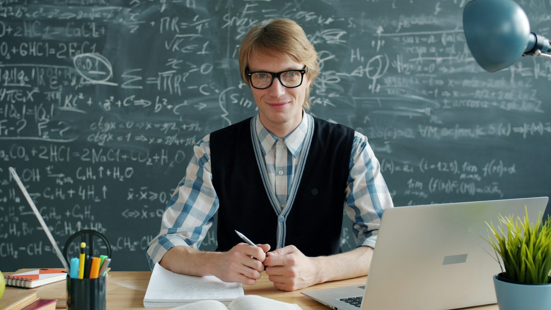 Male tutor at a desk